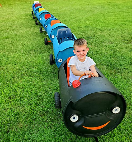 A child enjoying the barrel train ride at the Pumpkin Patch at Prior Creek Farms in Southeast Kansas